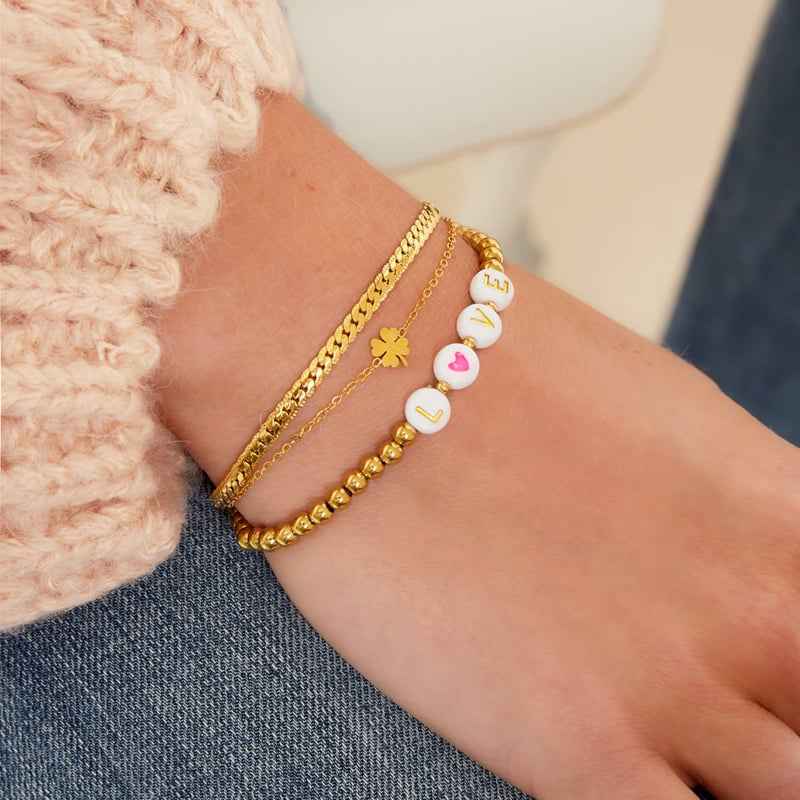 Dubbele armband staal goud met klavertje vier - Idhuna Jewels