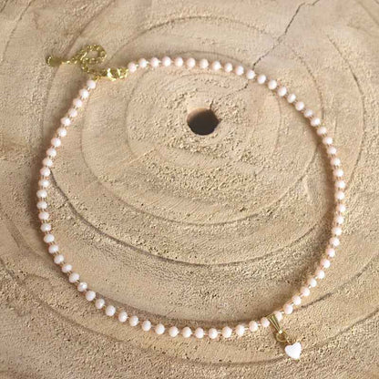 Dames Ketting Beige Facet glaskralen Rvs goud Parelmoer Hartje - Idhuna Jewels