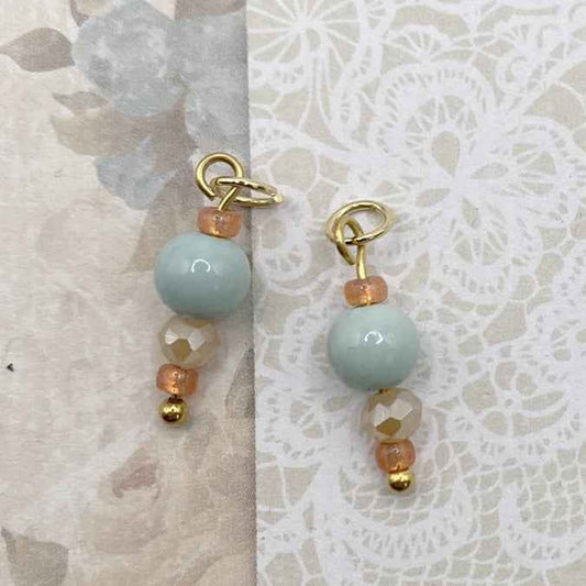 Rvs bedels goud voor oorringen lichtblauwe kralen met warme touch - Idhuna Jewels